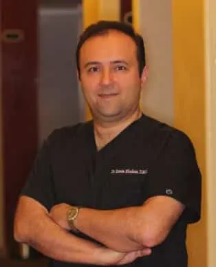 Dr. Khoshsar in scrubs inside the Baker Ranch Dental Spa office in Lake Forest