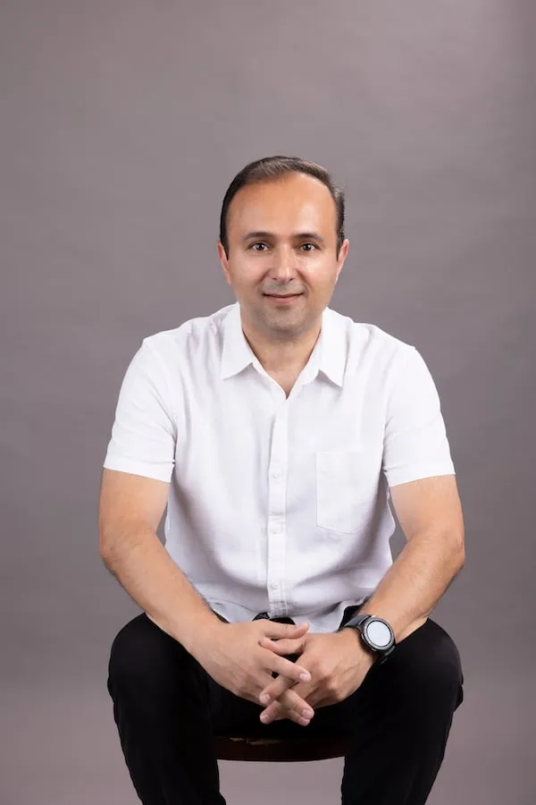 Dr. Ramin Khoshsar, Orange County implant dentist, smiling in a relaxed portrait